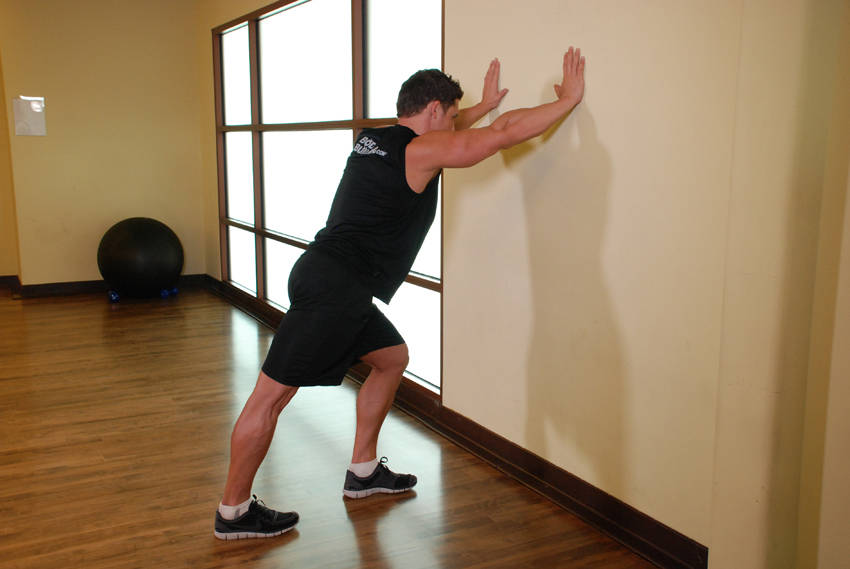 Calf Stretch Hands Against Wall — Body Weight Calves exercise demonstration