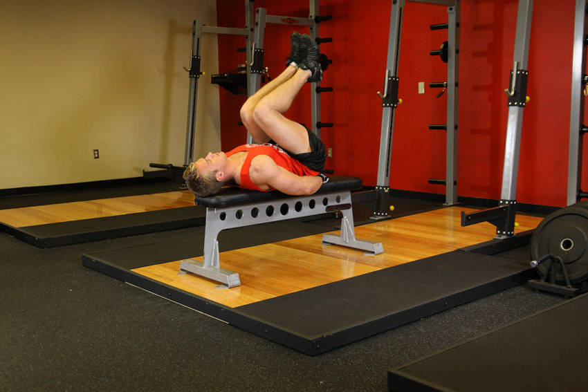 Flat Bench Leg Pull-In — Body Weight Abdominals exercise demonstration