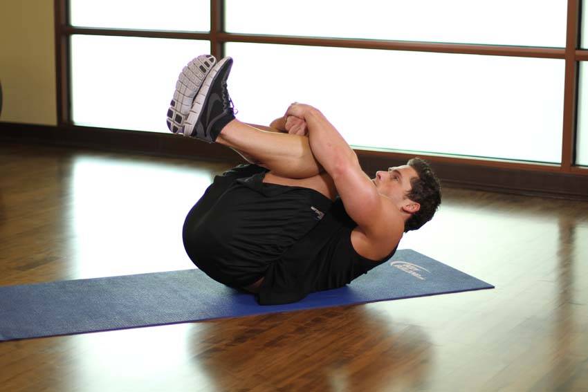 Hug Knees To Chest — Body Weight Lower Back exercise demonstration