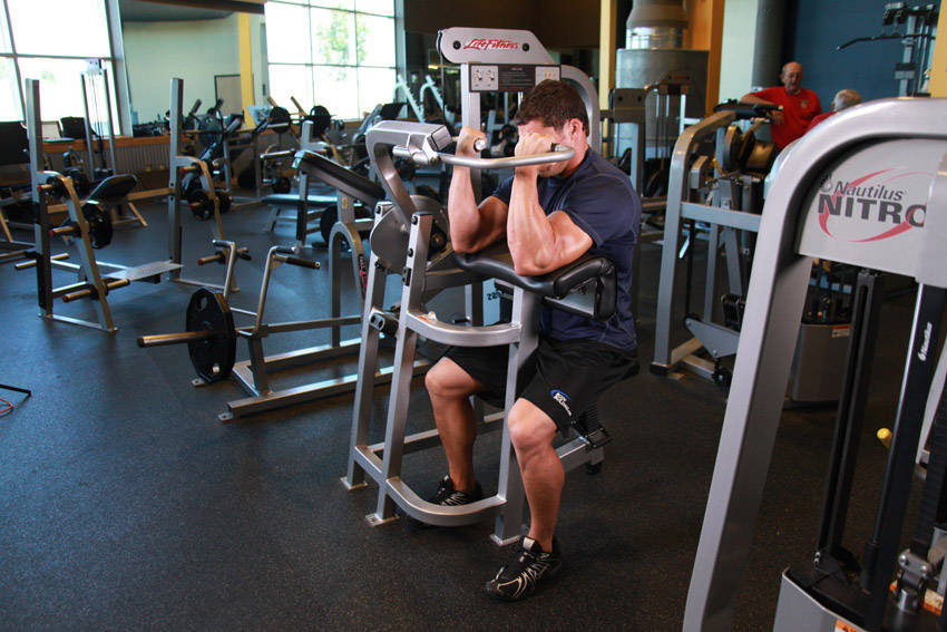 Machine Preacher Curls — Machine Biceps exercise demonstration