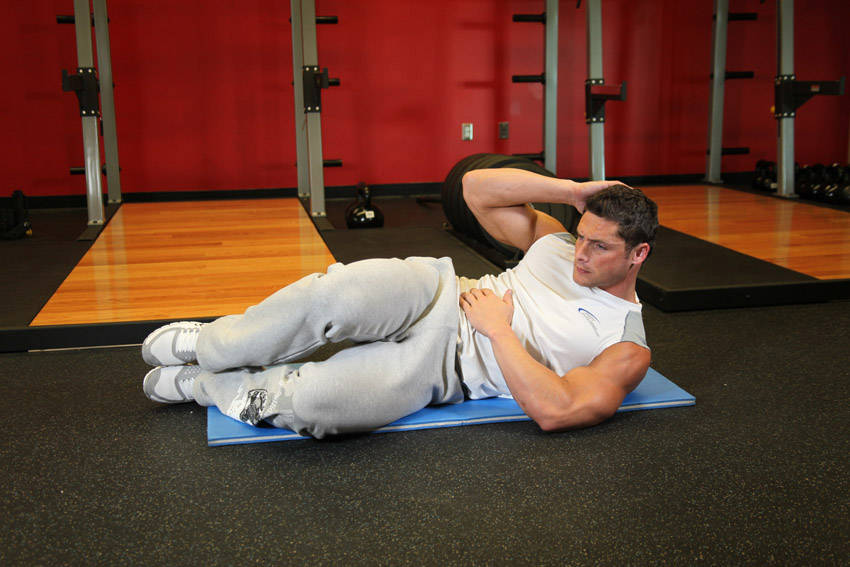 Oblique Crunches - On The Floor — Body Weight Abdominals exercise demonstration