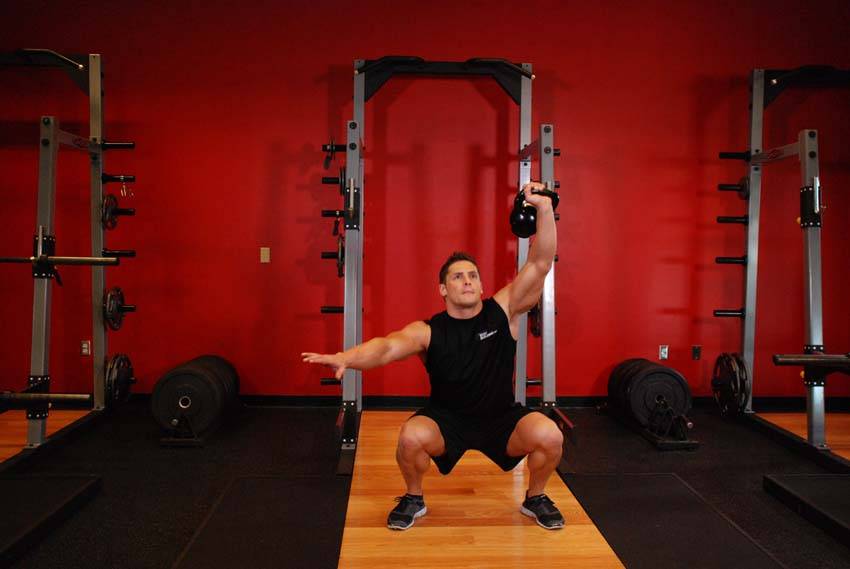 One-Arm Overhead Kettlebell Squats — Kettlebell Quadriceps exercise demonstration