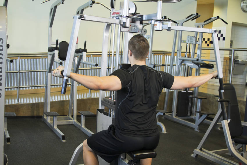 Reverse Machine Flyes — Machine Shoulders exercise demonstration
