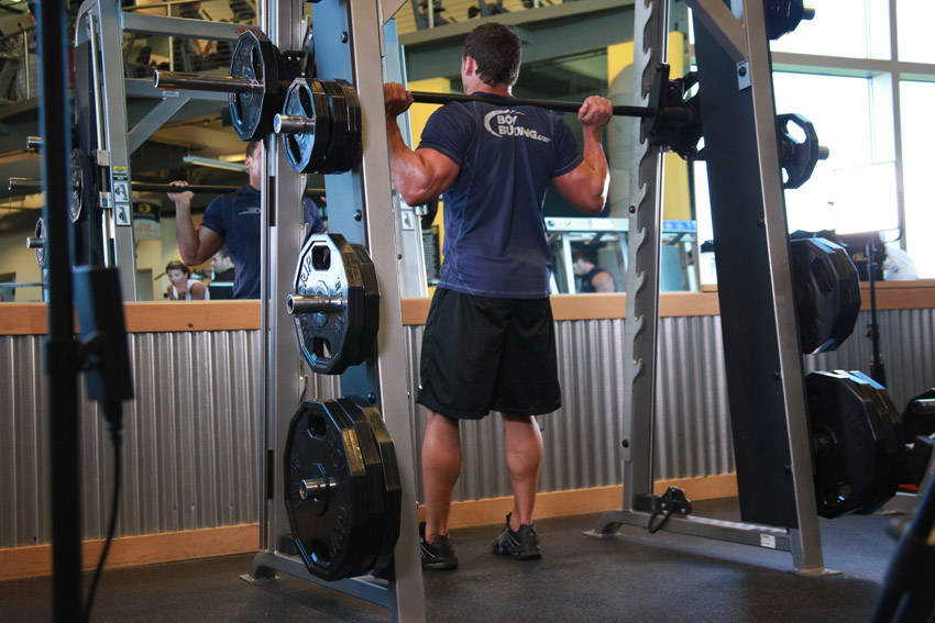 Smith Machine Squat — Machine Quadriceps exercise demonstration