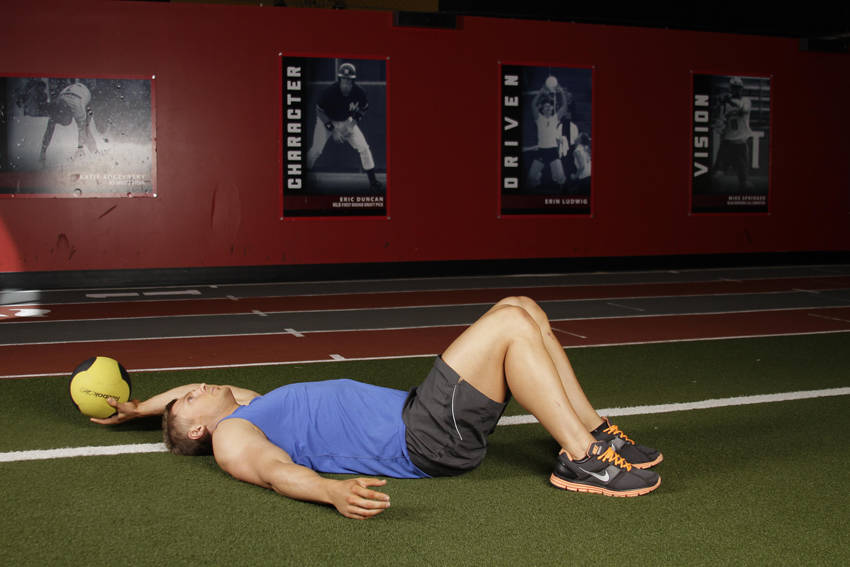 Supine One-Arm Overhead Throw — Medicine Ball Abdominals exercise demonstration