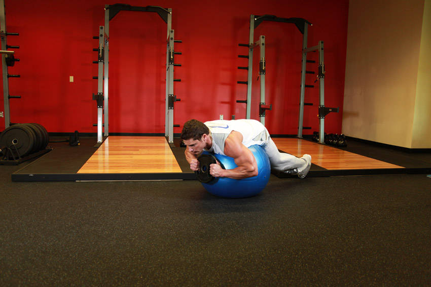 Weighted Ball Hyperextension — Stability Ball Lower Back exercise demonstration