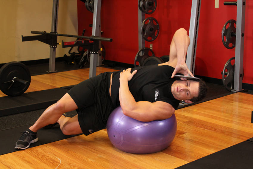 Weighted Ball Side Bend — Stability Ball Abdominals exercise demonstration