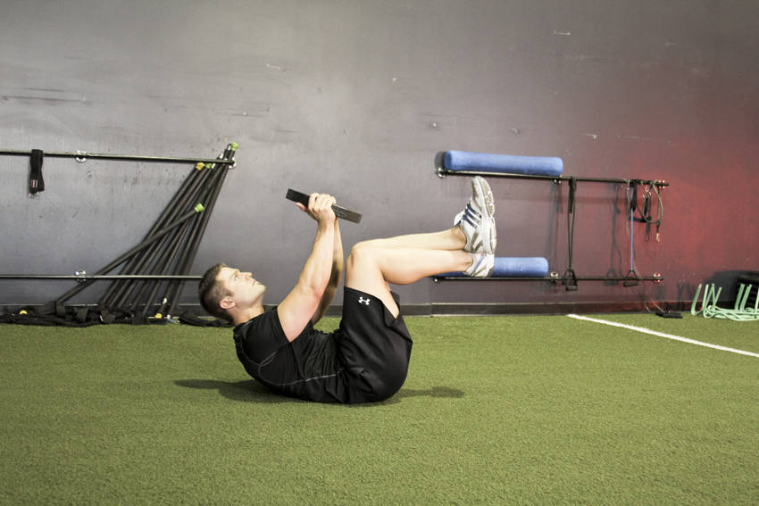 Weighted Crunches — Medicine Ball Abdominals exercise demonstration